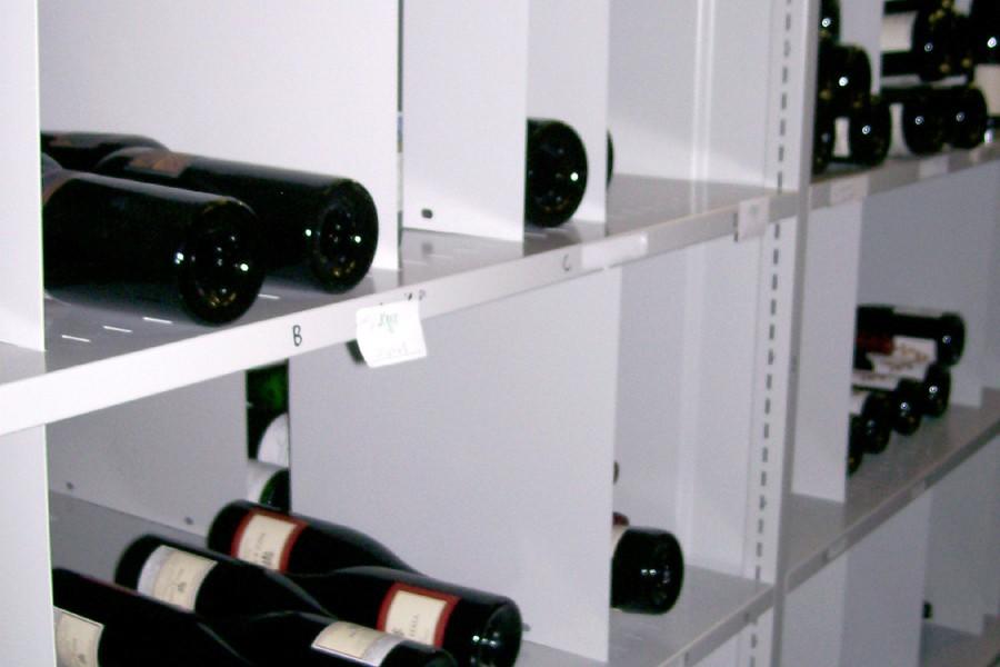 Wine bottle storage in individual compartments.