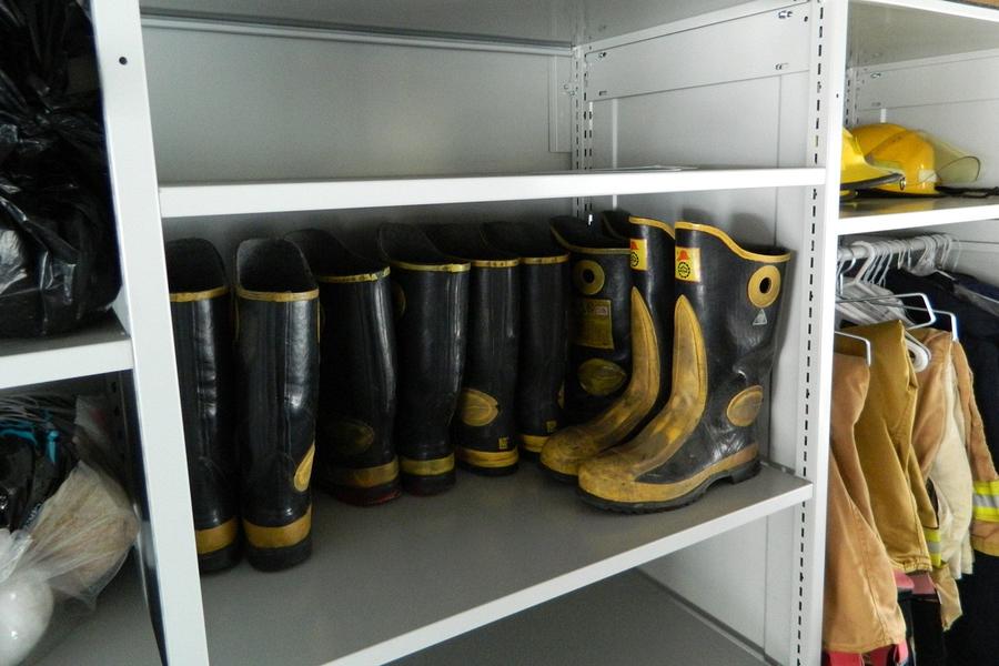 Protective boots stored on a shelf.
