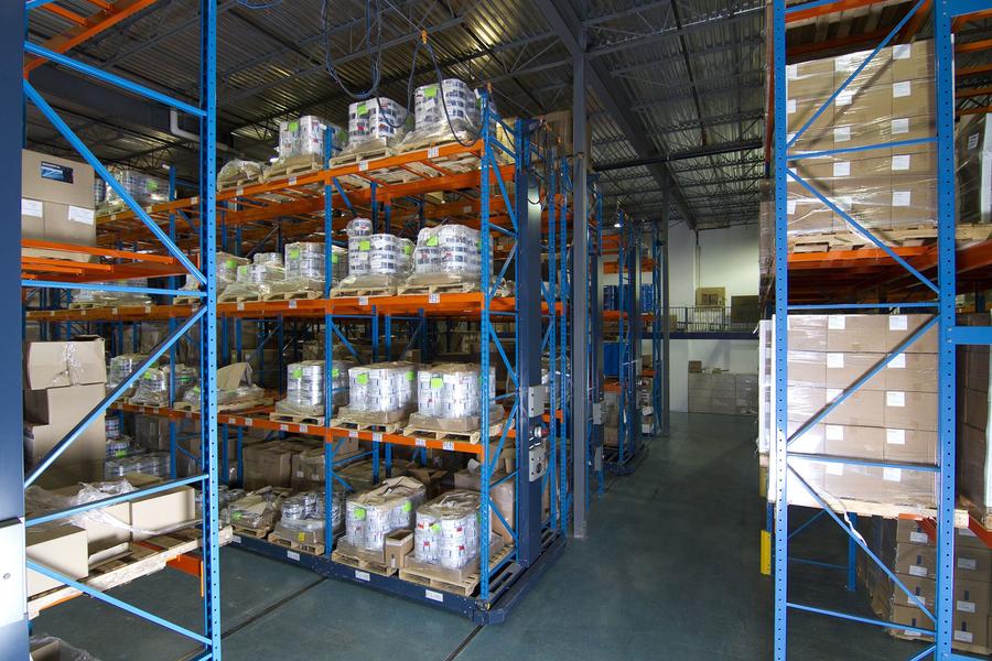 Warehouse shelving with stored pallets of materials for an industrial client.