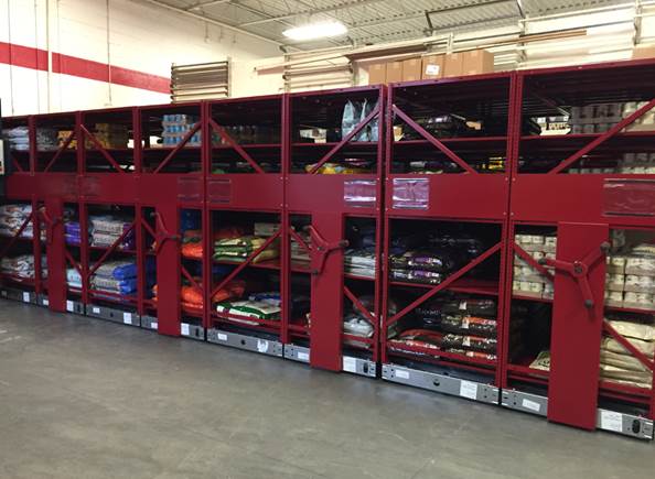 Red storage shelves containing various items, demonstrating a robust storage system.