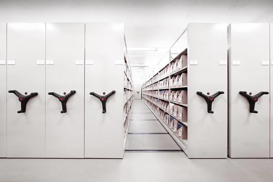 Mobile shelving system for maximizing archive storage space.