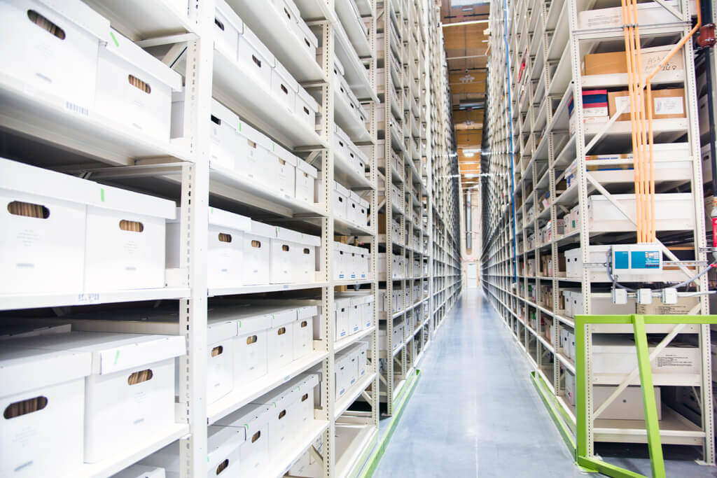 White shelves with open drawers, demonstrating easy access to stored items.