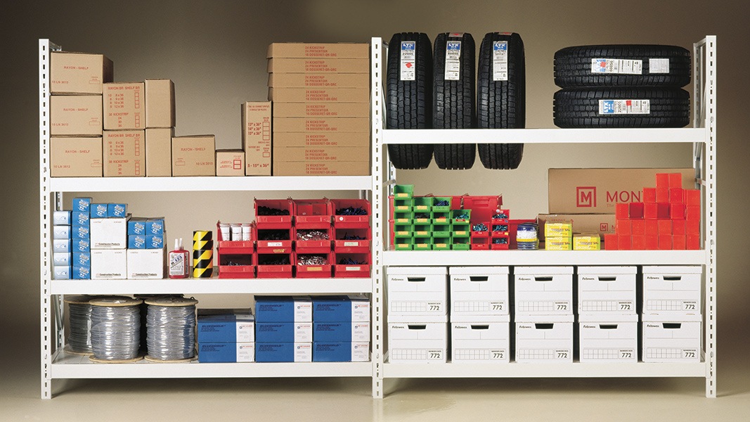 Organized storage shelves with boxes of various sizes and rolls, reflecting efficient space management.