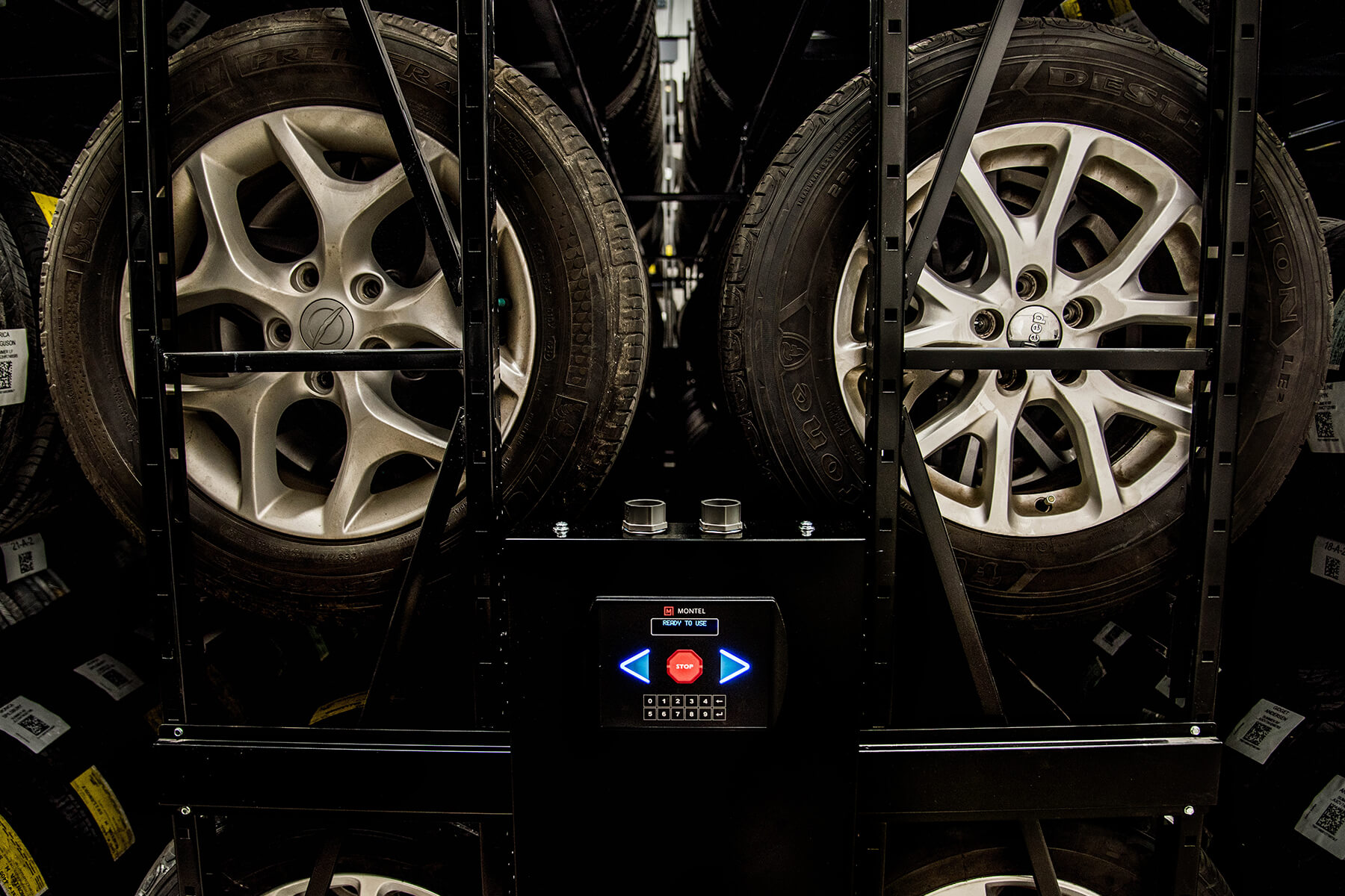 Close-up view of an electronic control panel on a Montel tire shelving system.