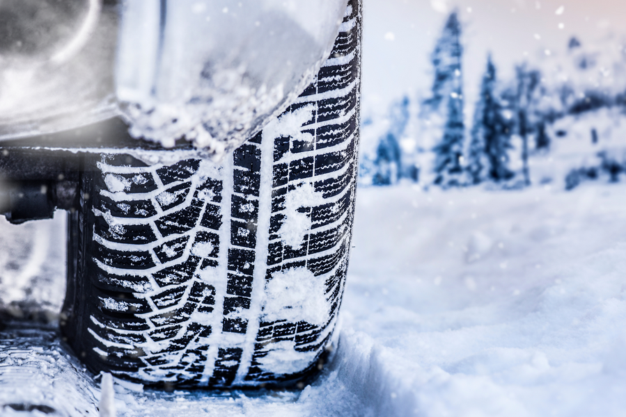 Winter tire on snowy road.