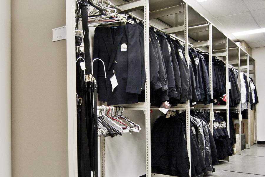 Uniforms hanging in a storage arUniforms hanging in a storage area for law enforcement.ea for law enforcement.