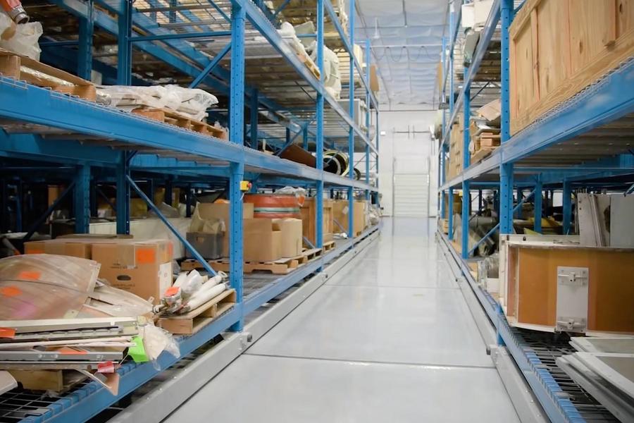 Industrial storage shelving with various items in a warehouse.