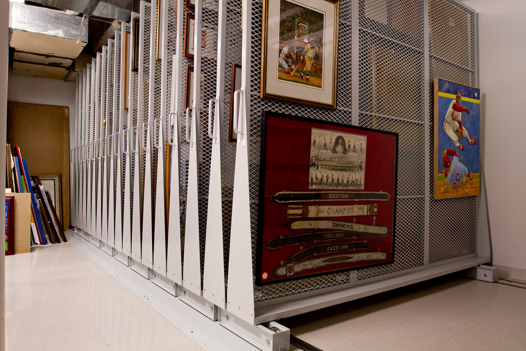 Storage shelving with framed artworks, showcasing an organized storage space.