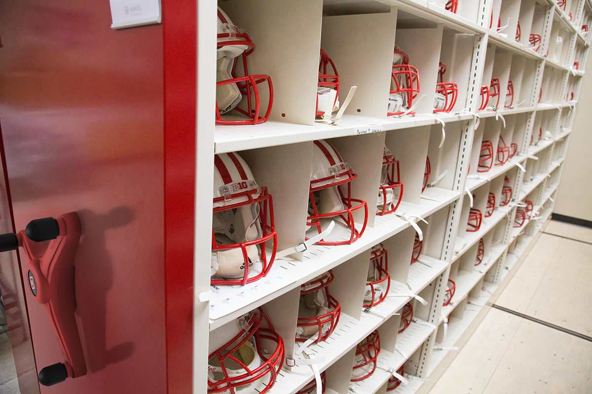 Montel shelving with individual storage compartments for football helmets.