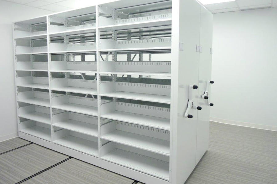 White mobile shelving with adjustable shelves for general storage.